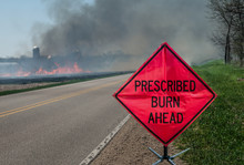 Prescribed Agricultural Burn Area And Sign:  A Sign Warns Motorists Of A Controlled Burn Area Ahead On A Farm In Southern Wisconsin. 