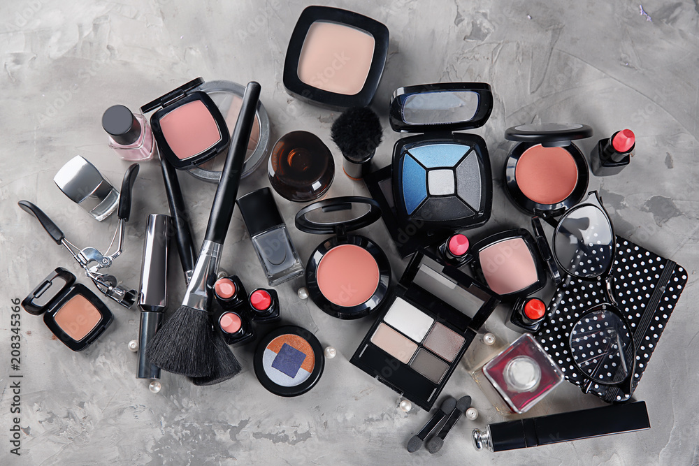 Flat lay composition with decorative cosmetics on gray background