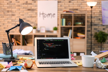 Home workplace with laptop on table