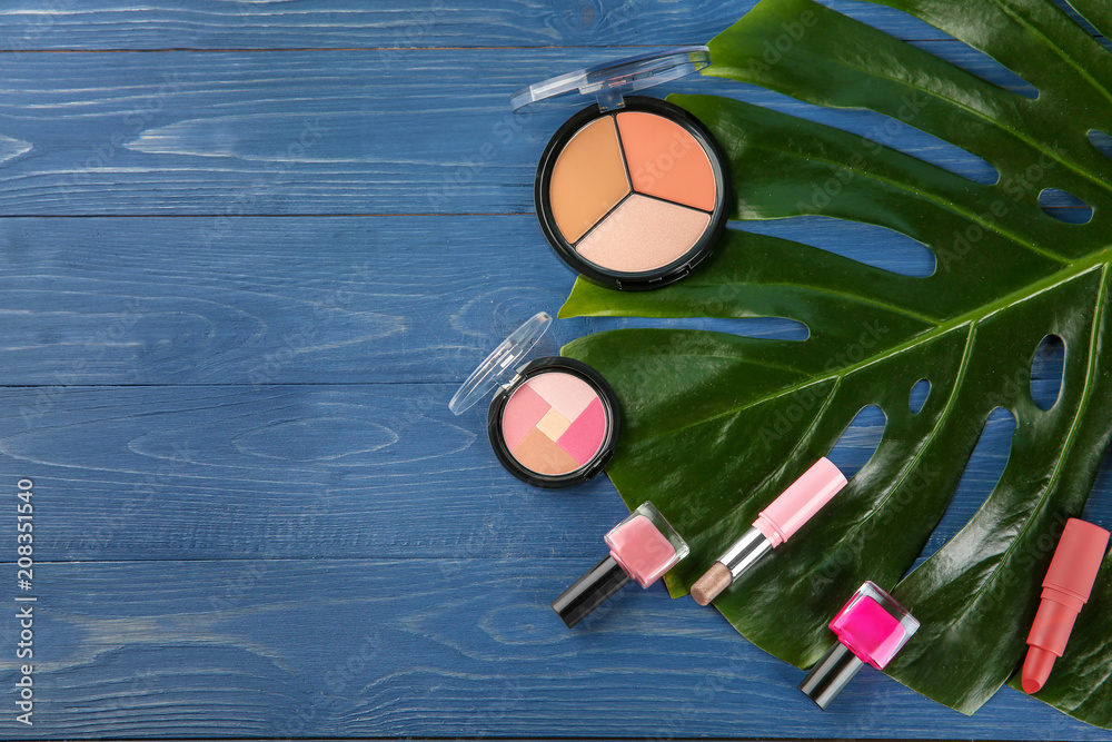 Flat lay composition with professional cosmetics on wooden background