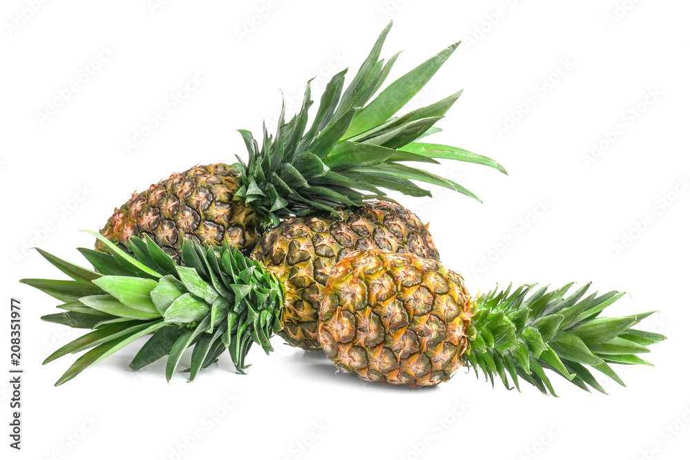 Fresh ripe pineapples on white background