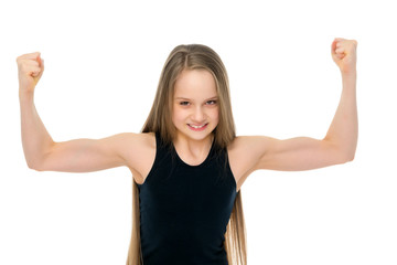 A little girl shows her muscles.