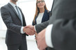 © ASDF - Business shaking hands in the office