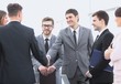 © ASDF - handshake business partners before business meeting