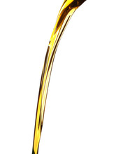Pouring Fresh Olive Oil On White Background