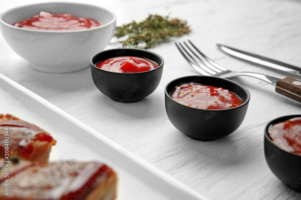 Delicious barbecue sauces in bowls on table