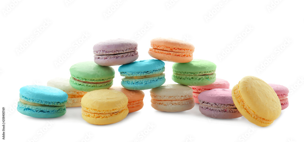Tasty colorful macarons on white background