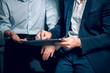 © Svyatoslav Lypynskyy - Two men working with touchpad. Cropped picture of two male office colleagues formaly dressed using touchpad to view presentation sitting in office.