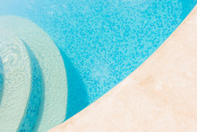 Clear Blue Water In The Pool. Part Of The Pool Closeup. Step Into The Water And Finish The Pool Bottom Slab-mosaic
