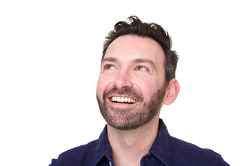 Close up of happy man with beard looking up