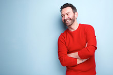 Cheerful Man With Beard Laughing Against Blue Background
