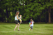 © Studio Romantic - Mother with children in summer park. Mothers Day.