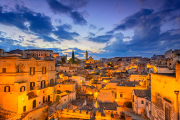 Wall Mural - Matera, Basilicata, Italy: Night view of the old town - Sassi di Matera, European Capital of Culture, at dawn