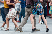 Closeup Of Legs Of Couple Of Tango Dancers In The Street