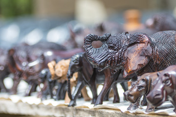 Close up of African Animals carved from wood in an open air market