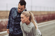 © Flamingo Images - Diverse young couple peparing to go for a jog outside