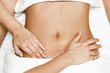 © javiindy - Hands massaging female abdomen.Therapist applying pressure on belly.