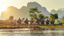 Village And Bungalows Along Nam Song River In Vang Vieng, Laos.