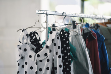 Women clothing on hangers in a boutique store