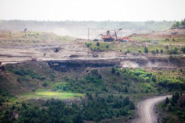 Wall Mural - Dump trucks and excavators working at open coal mine