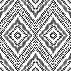 Wall Mural - The ornamental pattern on ethnic style. Vector illustration in black and white color palette. Exquisite seamless texture can be perfect for background images, wallpapers, textiles, wrapping papers.
