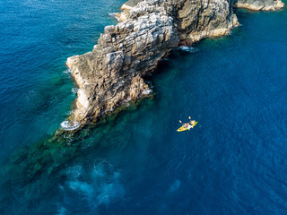 Wall Mural - Ocean Kayak above SCUBA divers on a tropical coral reef