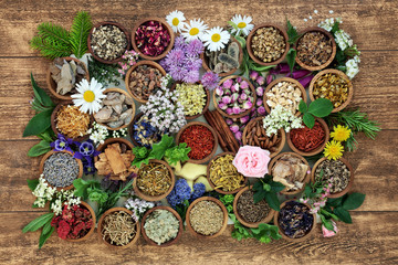 Wall Mural - Herbal medicine with herb, spices and flowers used in chinese and natural alternative remedies with fresh herbs and flowers on rustic background. Top view.