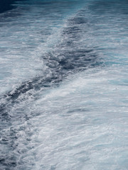 Wall Mural - Close up of  the sea that is foaming due to the ship's engine