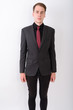 © Ranta Images - Young handsome businessman wearing suit against white background