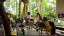 Bright Horse Carousel Spinning With Children - View From Inside