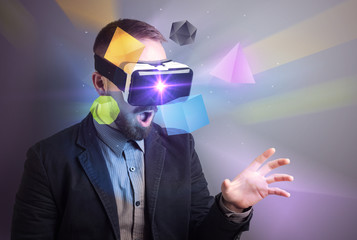Poster - Amazed businessman with virtual reality colorful geometric shapes in front of him
