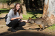 Female Tourist Hand Feeding Wallaby
