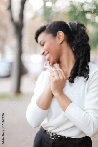 Fotografie, Obraz Beautiful black pretty female person wearing business clothes and having pony tail hair do