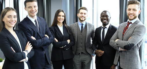 Wall Mural - group of businesspeople standing together in office.