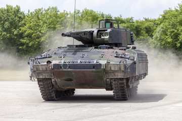 Wall Mural - German infantry fighting vehicle drives on a street