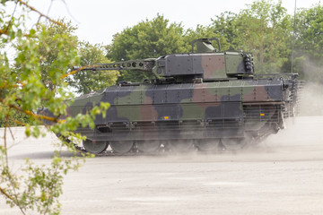 Wall Mural - German infantry fighting vehicle drives on a street