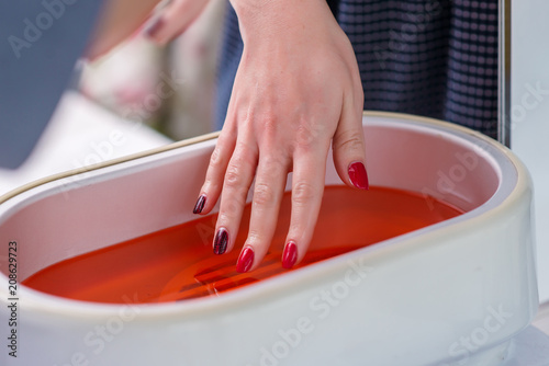 Fotomural Skin treatment with paraffin, rejuvenation in the beauty salon.