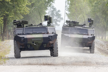 german light armoured reconnaissance vehicle drives on a road