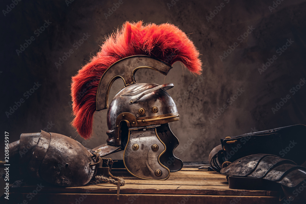 Complete combat equipment of the ancient Greek warrior lie on a box of wooden boards. - obrazy, fototapety, plakaty 