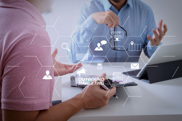 Poster - Businessmen working together on a document and using smart phone and digital tablet and laptop computer in modern office