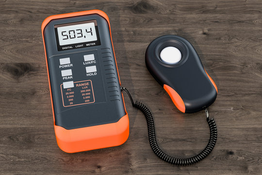 Digital luxmeter, light meter on the wooden table. 3D rendering
