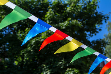 colorful triangular flags of decorated celebrate outdoor party sunlight