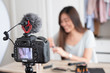 © weedezign - Asian young female blogger recording vlog video with makeup cosmetic at home online influencer on social media concept.live streaming viral.
