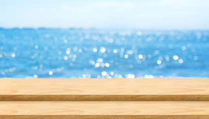 Aufkleber - Empty plank wood table top with blur blue sky and sea bokeh background,Mock up template for display or montage of product or content use as banner in social media ads.