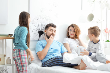 Wall Mural - Children waking up their parents in bedroom