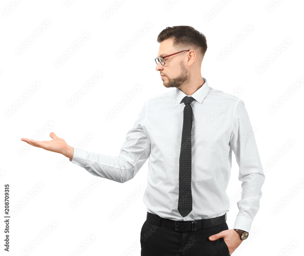 Young businessman holding something on white background