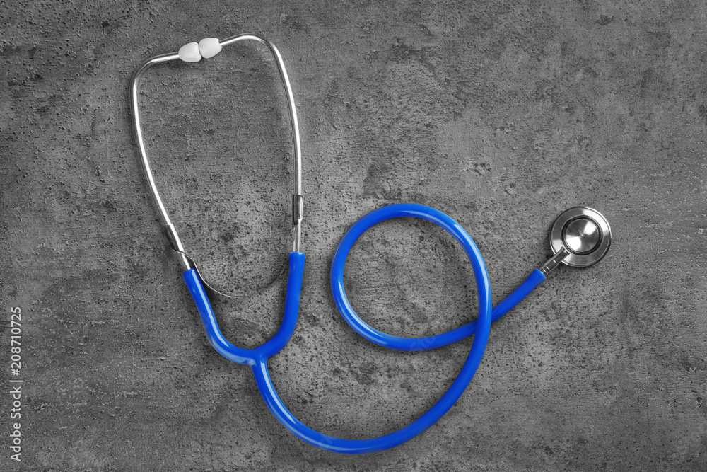 Stethoscope on dark grey background