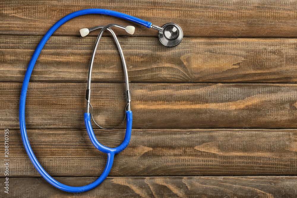 Stethoscope on wooden background