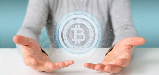 Poster - Man holding a technology Bitcoin icon on a circle 3d rendering