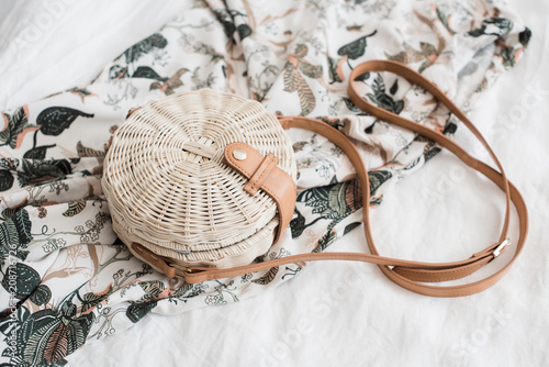 Fotomural Round ladys wickered straw handbag on white linen